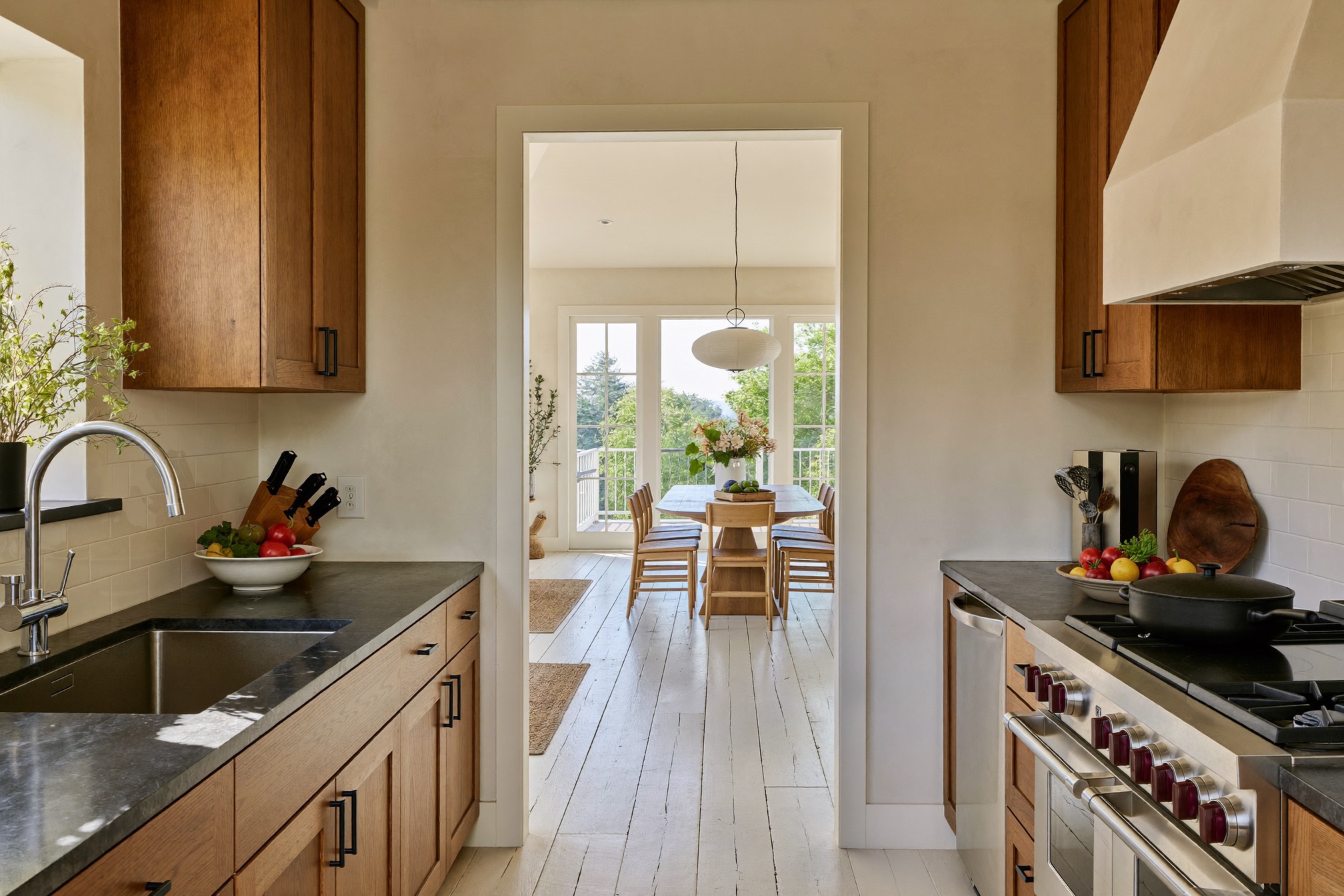 Renovated kitchen opening to a bright dining area in a St. Paul home