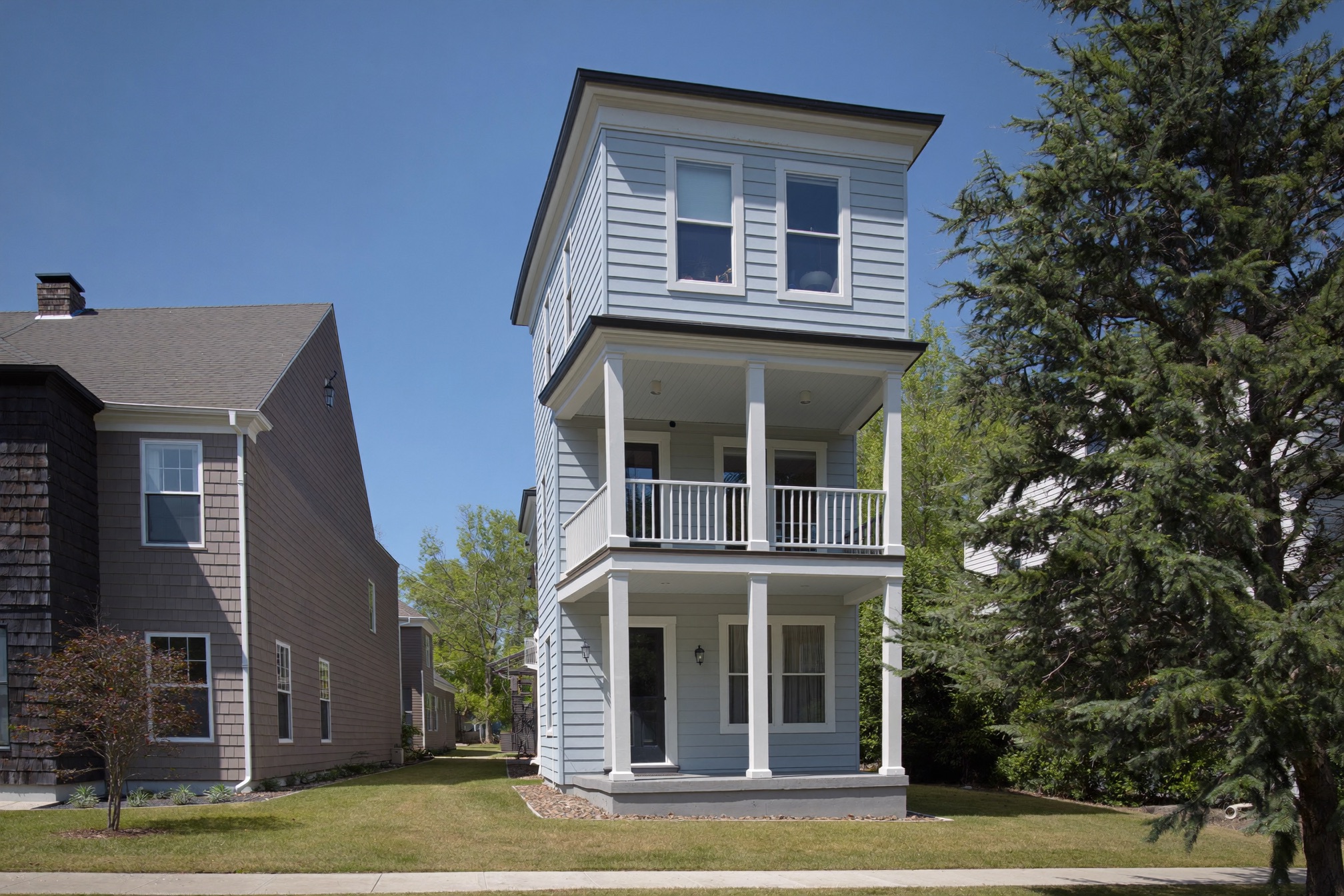 Two-story home addition with new siding matched to a craftsman house